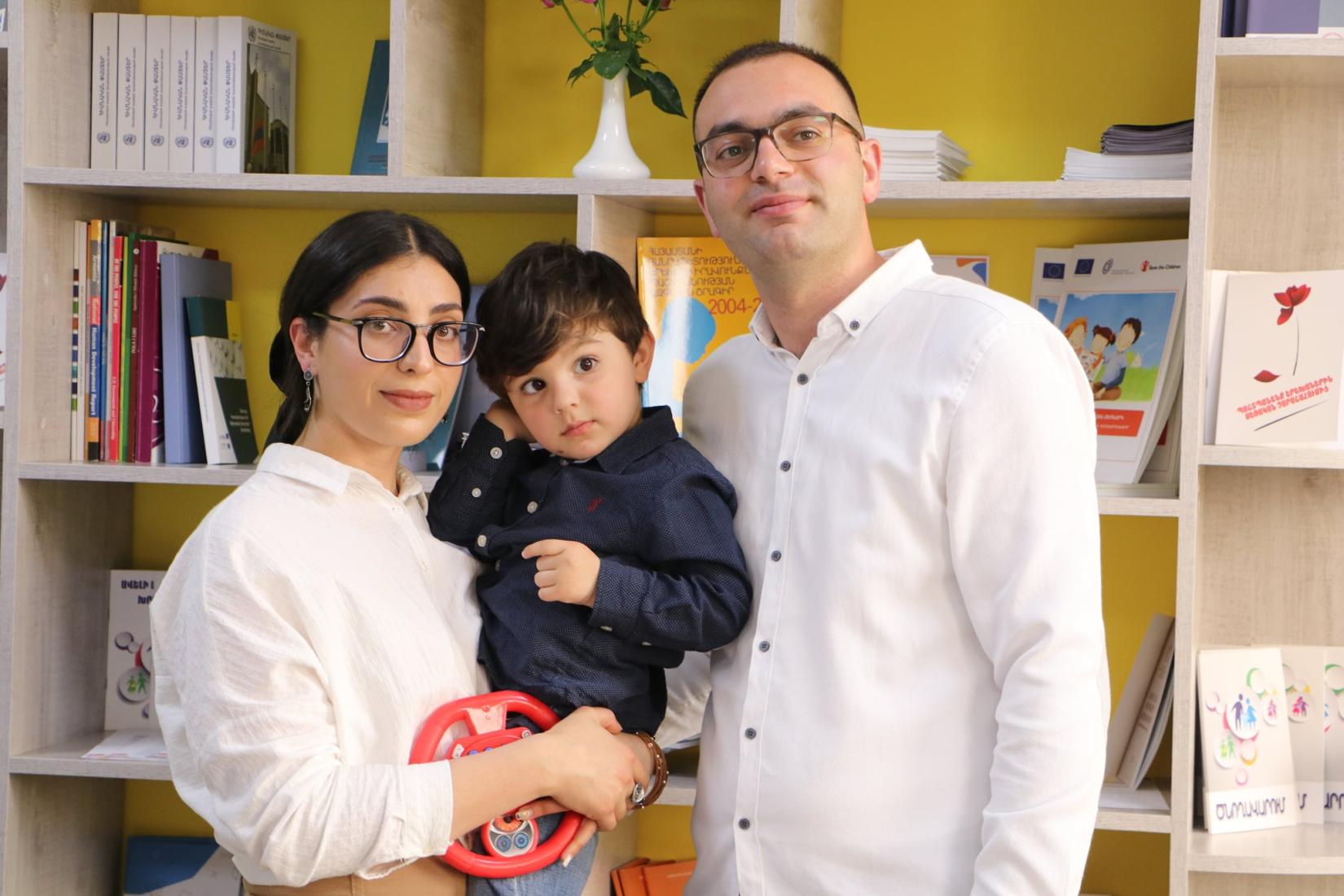 Ani and Gevorg, participants of "Caring for Equality" training, with their son. 