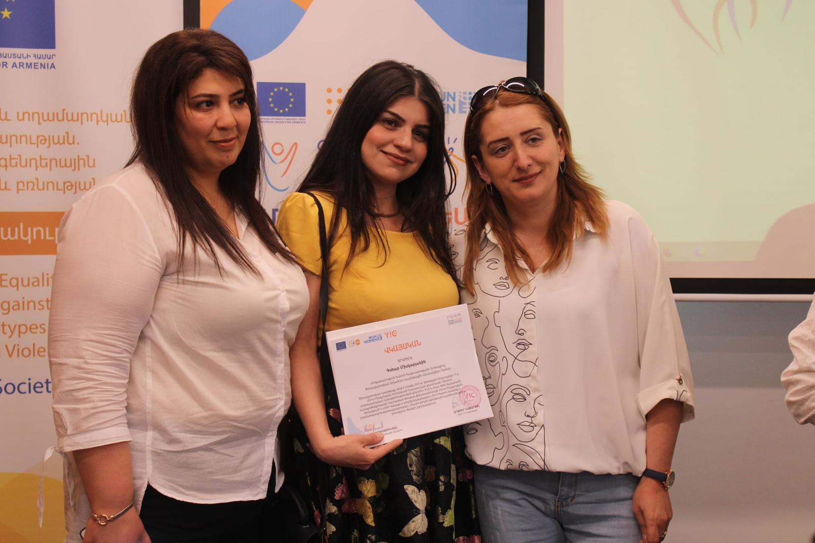 The facilitators of the "Caring for Equality" training with Gohar, one of the participants.