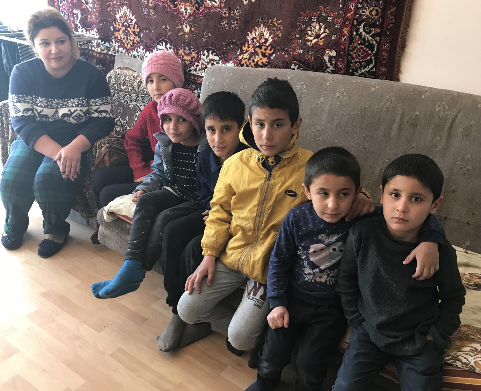 A mother with six-children in a refugee-like situation live in an apartment provided by a host family in Martuni, Gegharkunik Province, Armenia.