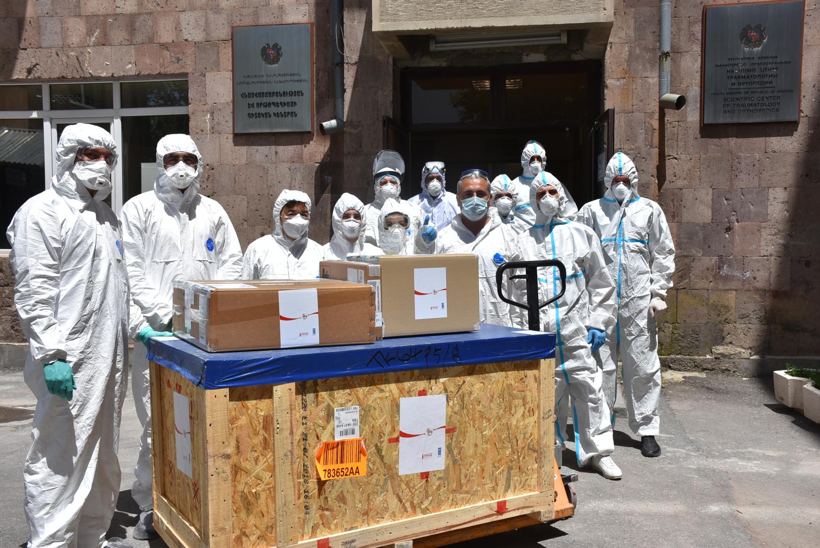 Medical workers receive the medical equipment.