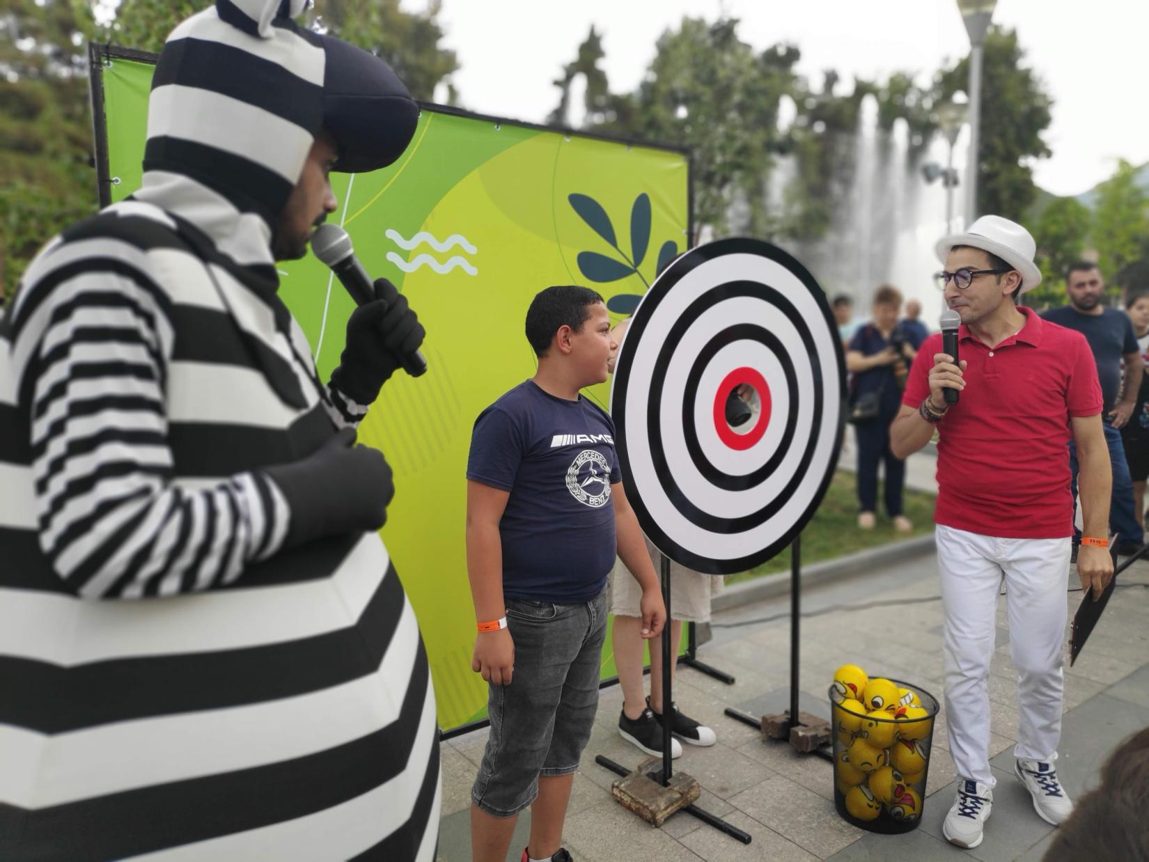 A boy answers to a question at the "Save the Planet SDGs" fun and educational Zebra Game.