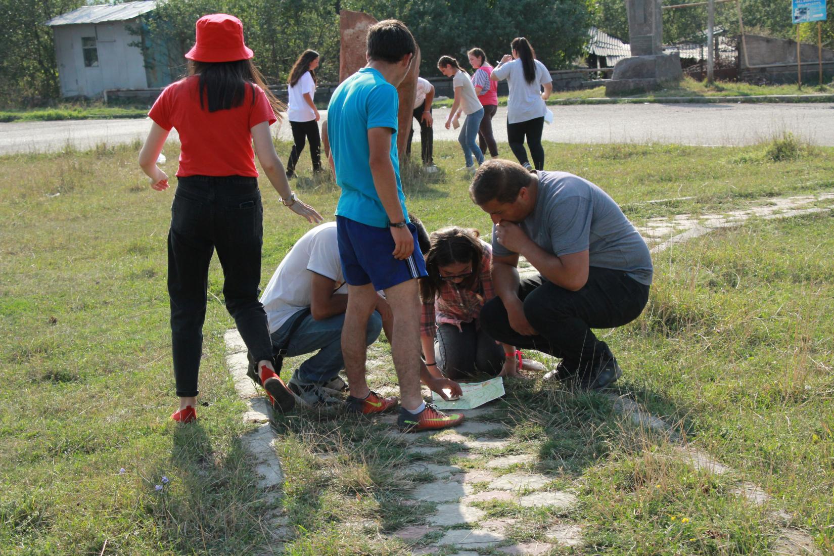 A groups young people explore the quest map. 