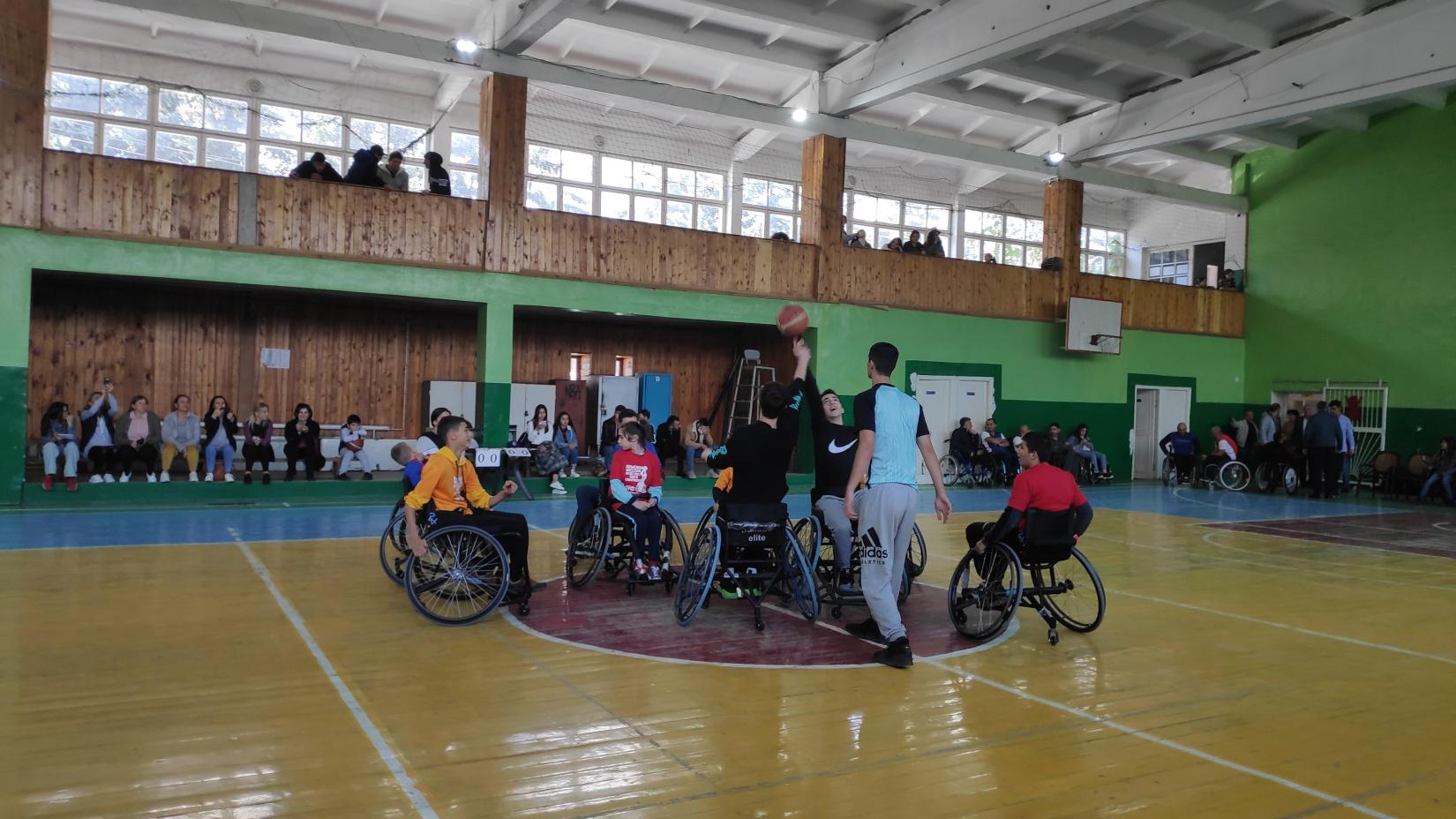 Athletes of the first children and young people wheelchair basketball club in Armenia, "Motus Vita" start their demonstration game.