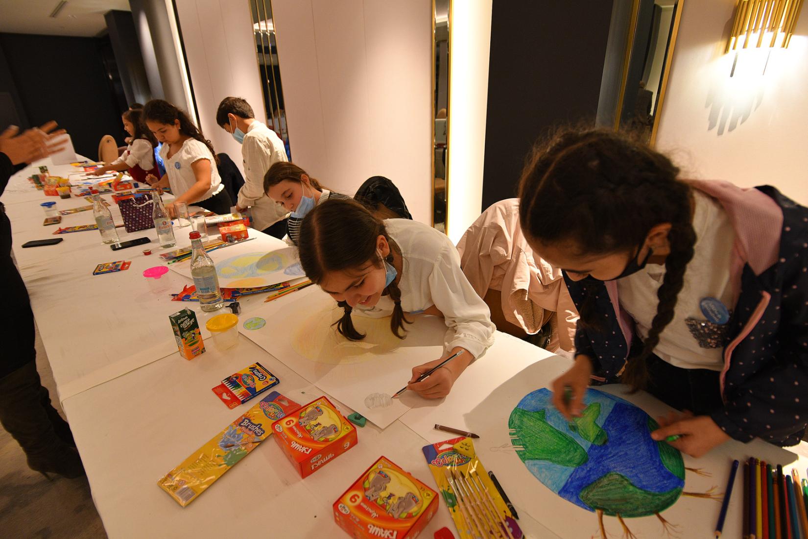 Kids working hard on their paintings!