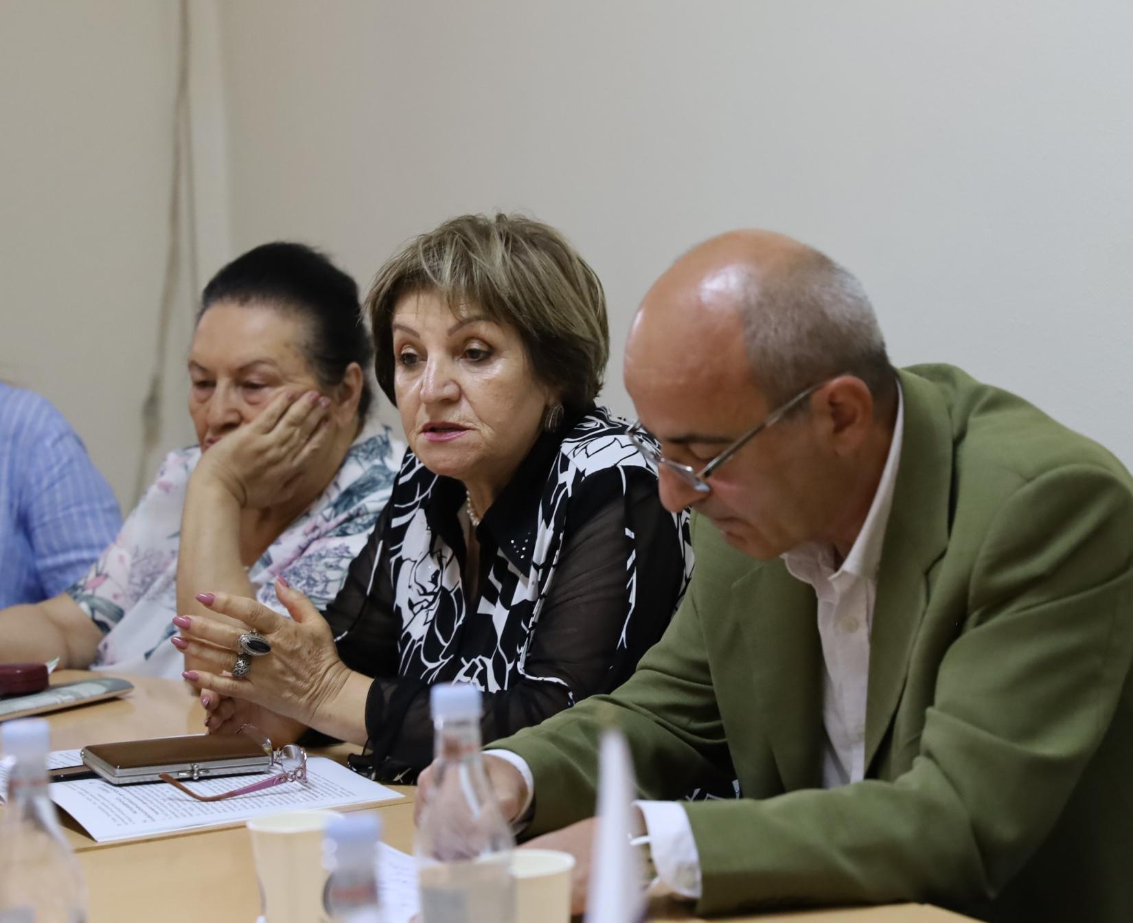 Three adults (two women and a man) during the meeting in Kapan.