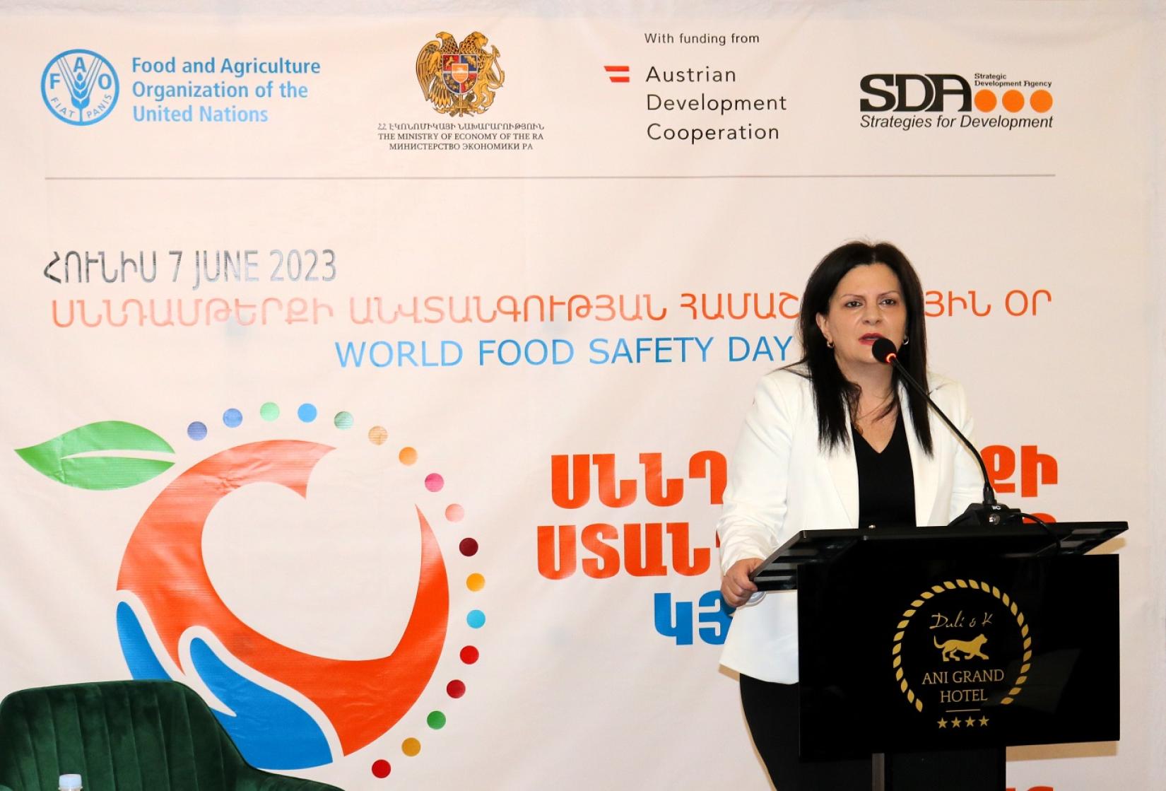A woman delivers a speech on World Food Safety Day.
