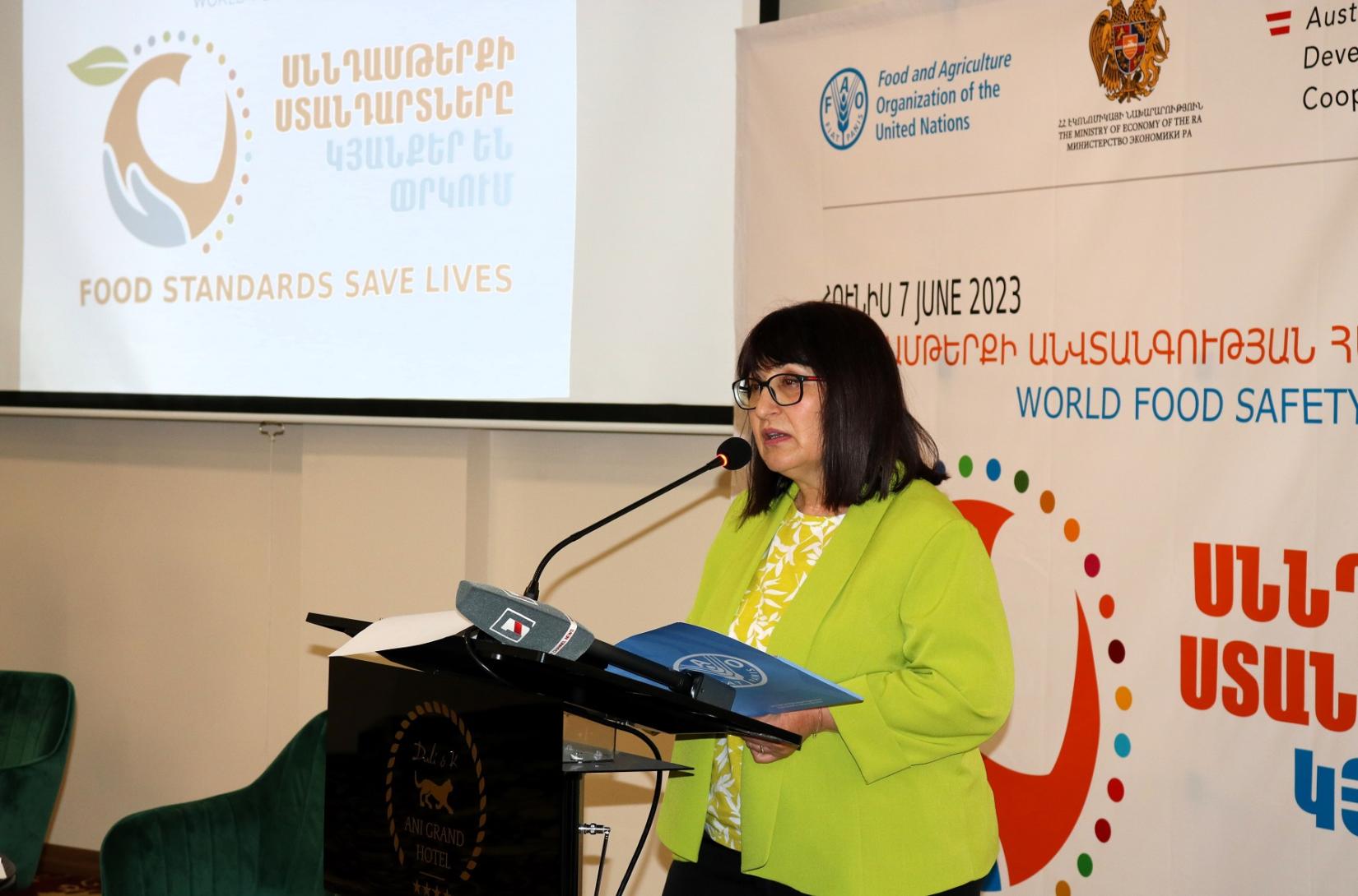 A woman delivers a speech on the World Food Safety Day.