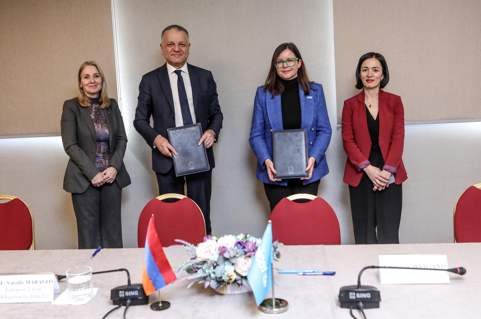 Four high-level officials signed an agreement.
