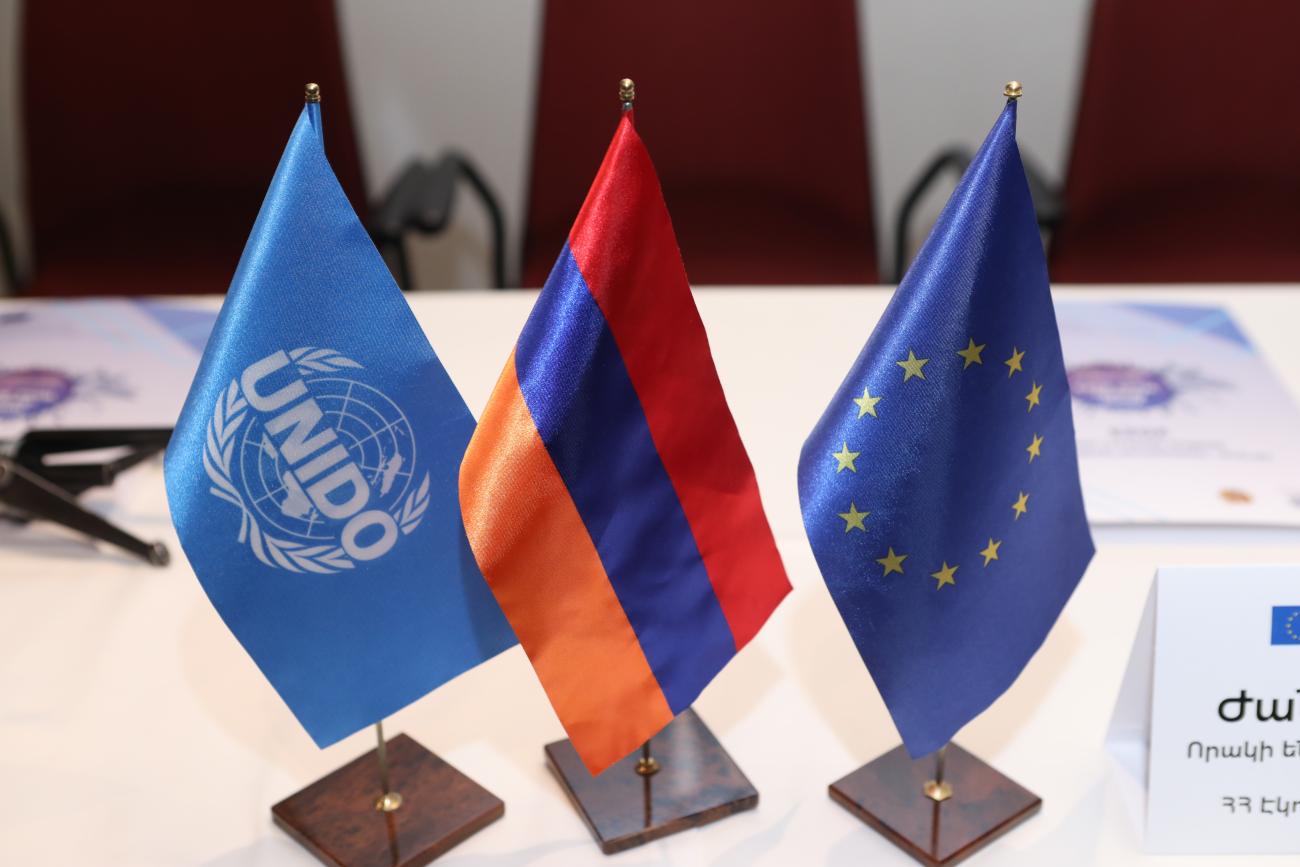 Flags of UNIDO, Armenia and the EU.
