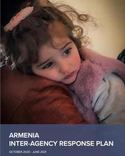 A displaced mother and daughter at the distribution point for food and non-food items in Goris, Syunik Province, Armenia.