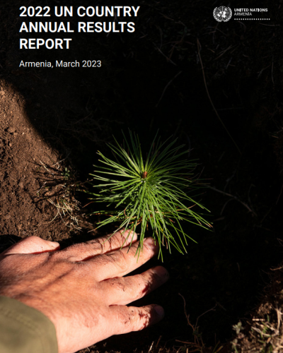 A man is planting a seedling.