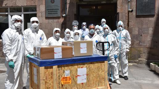 Medical workers receive the medical equipment.