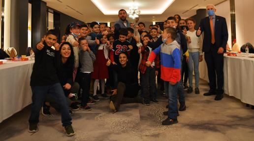 UN Resident Coordinator in Armenia with kids participating in the event take a funny group photo after the interactive game.