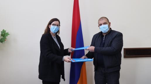 UNICEF Representative, Christine Weigand and Head of Tegh consolidated community, David Gulunts after signing the cooperation agreement.