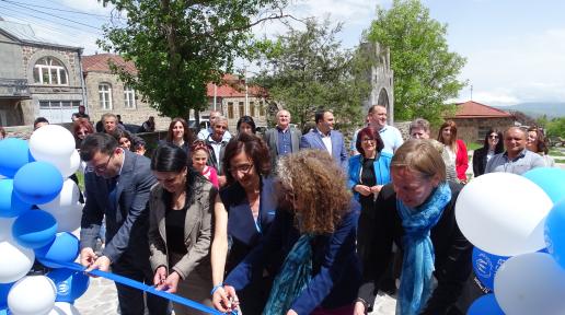 Five officials cutting the ribbon during the opening ceremony of the UNHCR Goris Field Unit office.