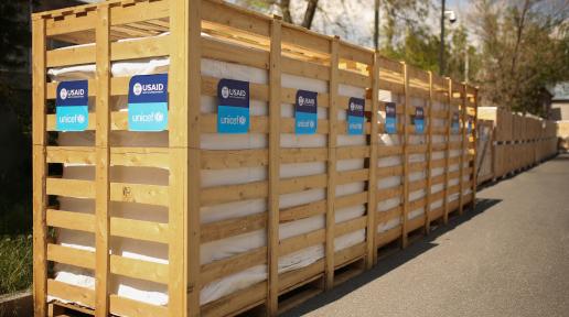 Three walk-in cold rooms with UNICEF and USAID logos.