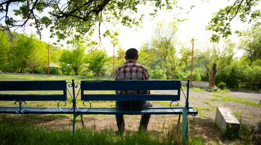 A man sitting on the bench.