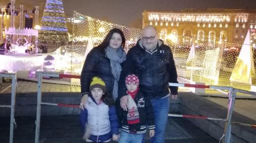 Family of four (Parents and their 2 sons) at the Republic Square in Yerevan.
