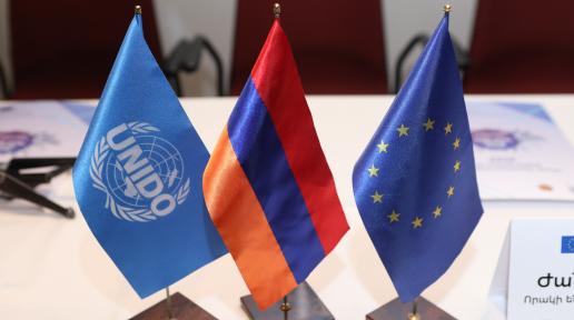 Flags of UNIDO, Armenia and the EU.
